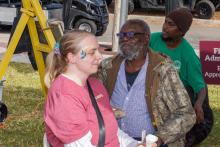 woman getting her face painted
